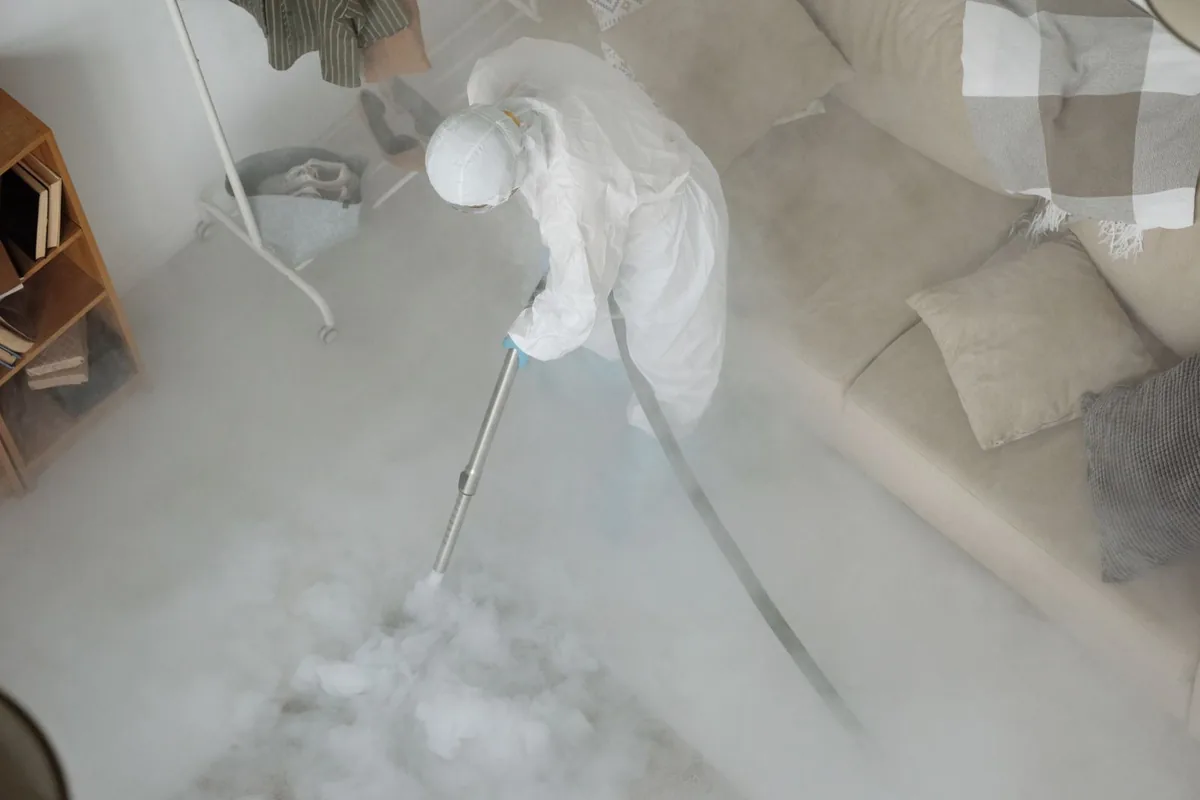 Biohazard cleanup technician in protective equipment, Mims, FL
